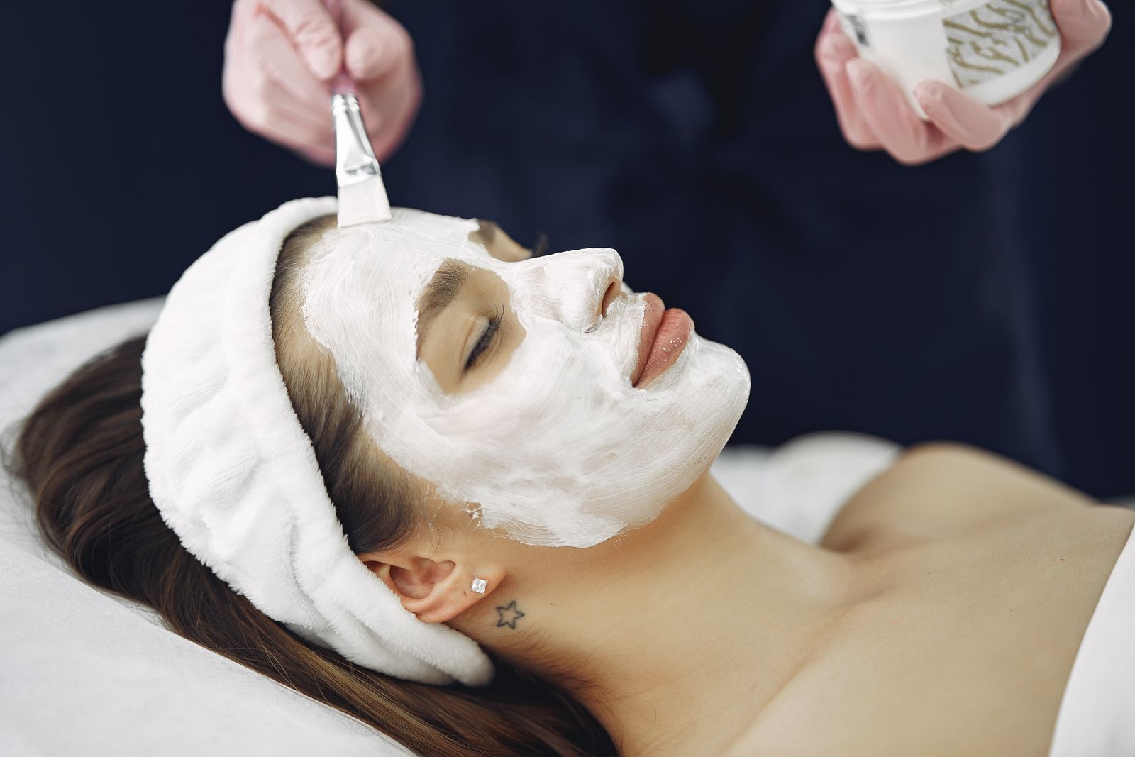 A treatment mask being applied during a facial.